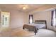 Cozy bedroom with ceiling fan and en-suite bathroom access at 4046 Lubec Ave, North Port, FL 34287