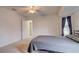 Bright bedroom with ceiling fan and access to a full bathroom at 4046 Lubec Ave, North Port, FL 34287