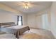 Spacious bedroom with ceiling fan and sliding door access at 4046 Lubec Ave, North Port, FL 34287