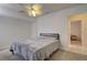 Spacious bedroom with ceiling fan and large closet at 4046 Lubec Ave, North Port, FL 34287