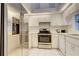 Modern kitchen with stainless steel appliances and white cabinetry at 4046 Lubec Ave, North Port, FL 34287