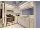 Bright kitchen features stainless steel appliances and white cabinetry at 4046 Lubec Ave, North Port, FL 34287