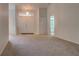 Open living room with high ceilings and neutral carpeting at 4046 Lubec Ave, North Port, FL 34287