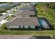 Aerial view of home with pool and screened enclosure, showcasing the backyard and surrounding neighborhood at 42115 Edgewater Dr, Punta Gorda, FL 33982