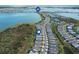 Aerial view showcasing home's waterfront location within a tranquil community at 42115 Edgewater Dr, Punta Gorda, FL 33982