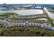 Aerial view of community with home location highlighted, nearby lake, and recreational amenities at 42115 Edgewater Dr, Punta Gorda, FL 33982