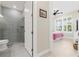 Bathroom with a glass shower door and toilet at 42115 Edgewater Dr, Punta Gorda, FL 33982