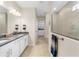Primary bathroom with double vanity, walk-in shower, and linen closet at 42115 Edgewater Dr, Punta Gorda, FL 33982