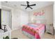 Bedroom with a pink comforter and white nightstand at 42115 Edgewater Dr, Punta Gorda, FL 33982