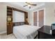 Comfortable bedroom with a murphy bed and built-in shelving at 42115 Edgewater Dr, Punta Gorda, FL 33982