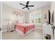 Bedroom with a pink comforter and built in shelving at 42115 Edgewater Dr, Punta Gorda, FL 33982