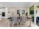 Farmhouse-style dining table with seating for six, near the kitchen at 42115 Edgewater Dr, Punta Gorda, FL 33982