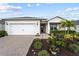 Attractive single-story home with a landscaped front yard and a two-car garage at 42115 Edgewater Dr, Punta Gorda, FL 33982