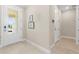 Clean and modern foyer with light colored tile flooring at 42115 Edgewater Dr, Punta Gorda, FL 33982