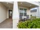 Charming front porch with rocking chairs and well manicured landscaping at 42115 Edgewater Dr, Punta Gorda, FL 33982