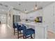 Modern kitchen with white cabinets, stainless steel appliances, and a large island at 42115 Edgewater Dr, Punta Gorda, FL 33982