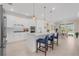 Bright kitchen featuring white cabinets, island with seating, and breakfast nook at 42115 Edgewater Dr, Punta Gorda, FL 33982