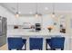 Modern kitchen with white cabinets and quartz countertops at 42115 Edgewater Dr, Punta Gorda, FL 33982