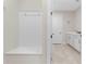 Functional laundry room with built-in storage and Whirlpool appliances at 42115 Edgewater Dr, Punta Gorda, FL 33982