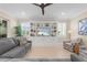 Living room with gray sectional sofa and built in shelving at 42115 Edgewater Dr, Punta Gorda, FL 33982