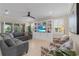 Living room with gray sectional sofa and built in shelving at 42115 Edgewater Dr, Punta Gorda, FL 33982