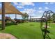 Modern playground with shaded seating and play structures at 42115 Edgewater Dr, Punta Gorda, FL 33982