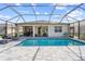 Inviting swimming pool with screened enclosure and lounge chairs at 42115 Edgewater Dr, Punta Gorda, FL 33982
