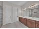 Double vanity bathroom with a large mirror and walk in shower at 4218 Vasco St, Punta Gorda, FL 33950
