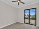 Empty bedroom with sliding glass doors and wood-look floors at 4218 Vasco St, Punta Gorda, FL 33950
