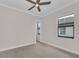 Empty bedroom with window and door to bathroom at 4218 Vasco St, Punta Gorda, FL 33950