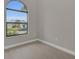 Spacious bedroom with an arched window and hardwood floors at 4218 Vasco St, Punta Gorda, FL 33950