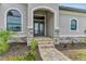Elegant front entry with double doors and stone accents at 4218 Vasco St, Punta Gorda, FL 33950