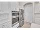 Stainless steel appliances and white shaker cabinets in this kitchen at 4218 Vasco St, Punta Gorda, FL 33950