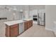 Kitchen island with sink, dishwasher, and white quartz countertops at 4218 Vasco St, Punta Gorda, FL 33950