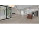 Open concept kitchen features island, stainless steel appliances, and white cabinetry at 4218 Vasco St, Punta Gorda, FL 33950