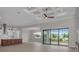 Open living space with high ceilings, kitchen island, and pool view at 4218 Vasco St, Punta Gorda, FL 33950