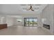 Open living space with high ceilings, kitchen island, and pool view at 4218 Vasco St, Punta Gorda, FL 33950
