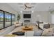 Living room features modern furniture, fireplace, and large TV at 4218 Vasco St, Punta Gorda, FL 33950