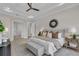 Spacious main bedroom with a large bed and access to other rooms at 4218 Vasco St, Punta Gorda, FL 33950
