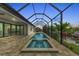 Long screened pool and spa with water view at 4218 Vasco St, Punta Gorda, FL 33950