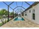 Relaxing pool area with screened enclosure, spacious patio, and modern design at 4218 Vasco St, Punta Gorda, FL 33950