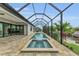Long screened pool and spa with water view at 4218 Vasco St, Punta Gorda, FL 33950