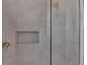 Shower with light gray tile and built-in shelf at 4218 Vasco St, Punta Gorda, FL 33950