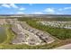 Aerial view of community with lake and surrounding landscape at 43620 Sparrow Dr, Punta Gorda, FL 33982