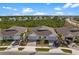 Three houses with attached garages and paved driveways at 43620 Sparrow Dr, Punta Gorda, FL 33982