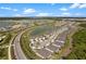 Aerial view of a new community with houses and landscaping at 43620 Sparrow Dr, Punta Gorda, FL 33982