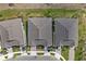Overhead view of three houses and landscaping at 43620 Sparrow Dr, Punta Gorda, FL 33982
