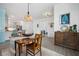 Farmhouse style dining room with wooden table and coastal decor at 43620 Sparrow Dr, Punta Gorda, FL 33982