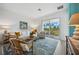 Open living space with comfy seating and access to a private patio at 43620 Sparrow Dr, Punta Gorda, FL 33982