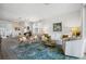 Spacious living room with a large area rug and comfortable furniture at 43620 Sparrow Dr, Punta Gorda, FL 33982